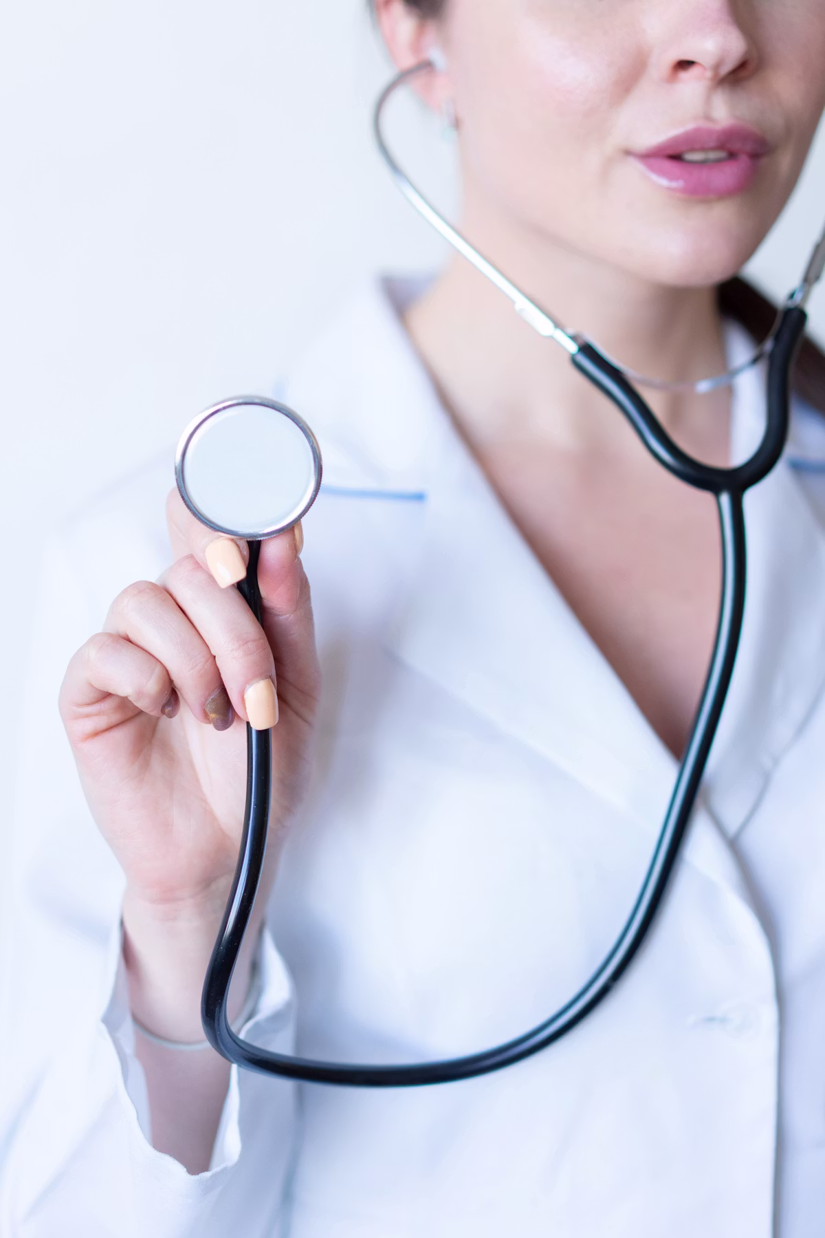 Clinician speaking with a patient during a bedside visit
